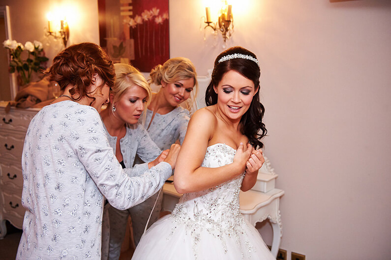 Getting ready with the bridal party at Sandhole Oak Barn