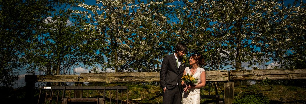 A happy couple stealing a moment at Sandhole Oak Barn