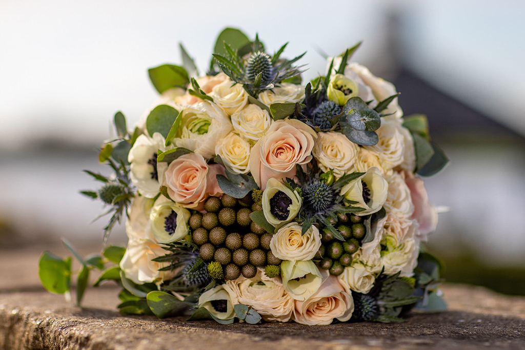 The bride’s bouquet was a mix of beautiful spring wedding flowers at this barn wedding