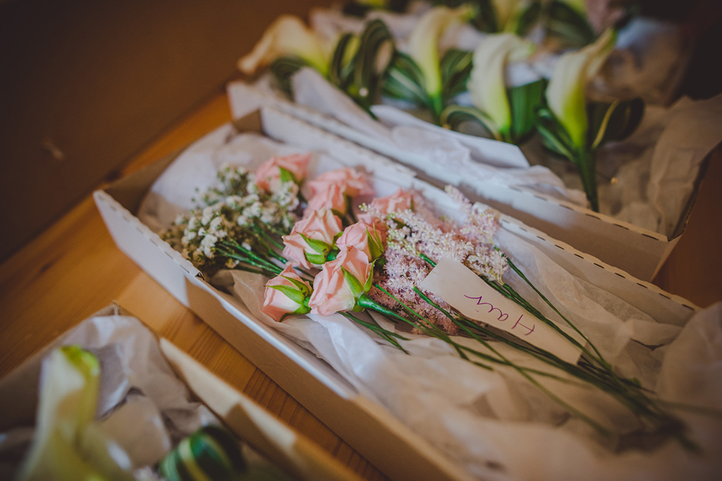 The buttonholes were made from beautiful delicate pastel coloured flowers at this barn wedding