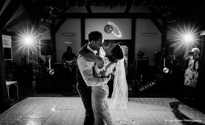 The bride and groom take to the floor for their first dance at Sandhole Oak Barn in Staffordshire