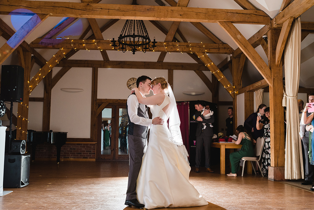 The happy couple take to the floor for their first dance at their wedding evening at Sandhole Oak Barn 