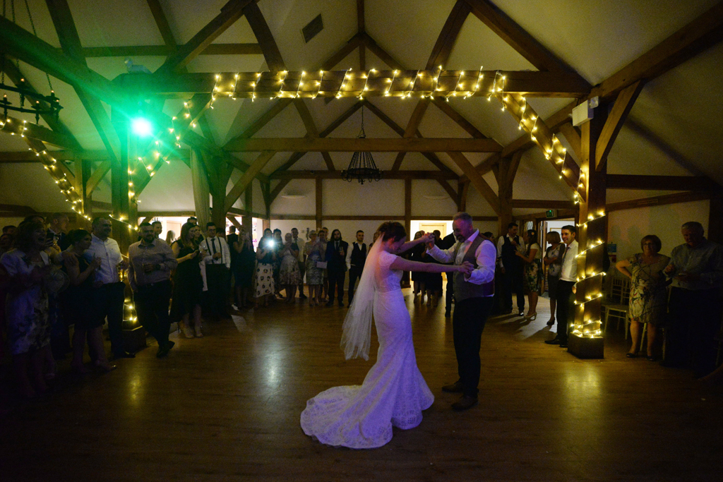 The happy newlyweds enjoy their first dance at this barn wedding at Sandhole Oak Barn in Cheshire