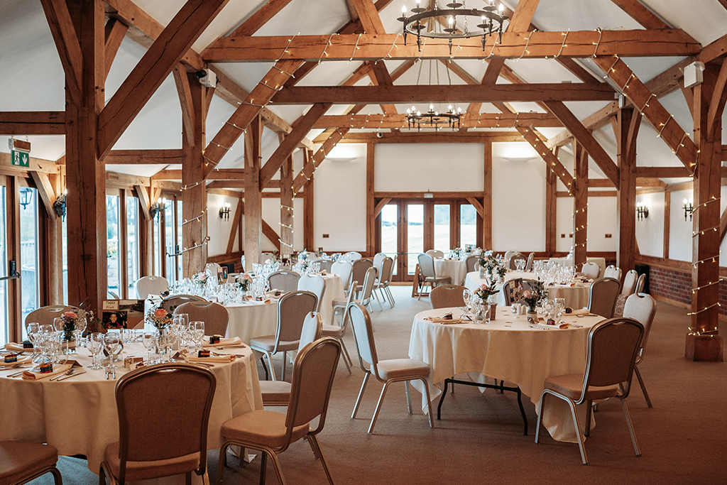 The oak barn was set up for the wedding breakfast at Sandhole Oak Barn in Cheshire