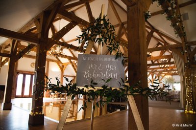 A pretty wedding sign welcomes guests to the wedding at this rural wedding venue in Cheshire