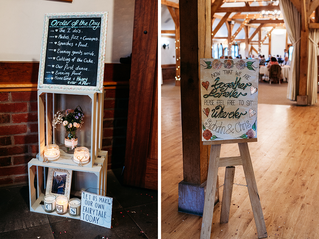 The couple made their own wedding signs for their wedding at Sandhole Oak Barn near Manchester 