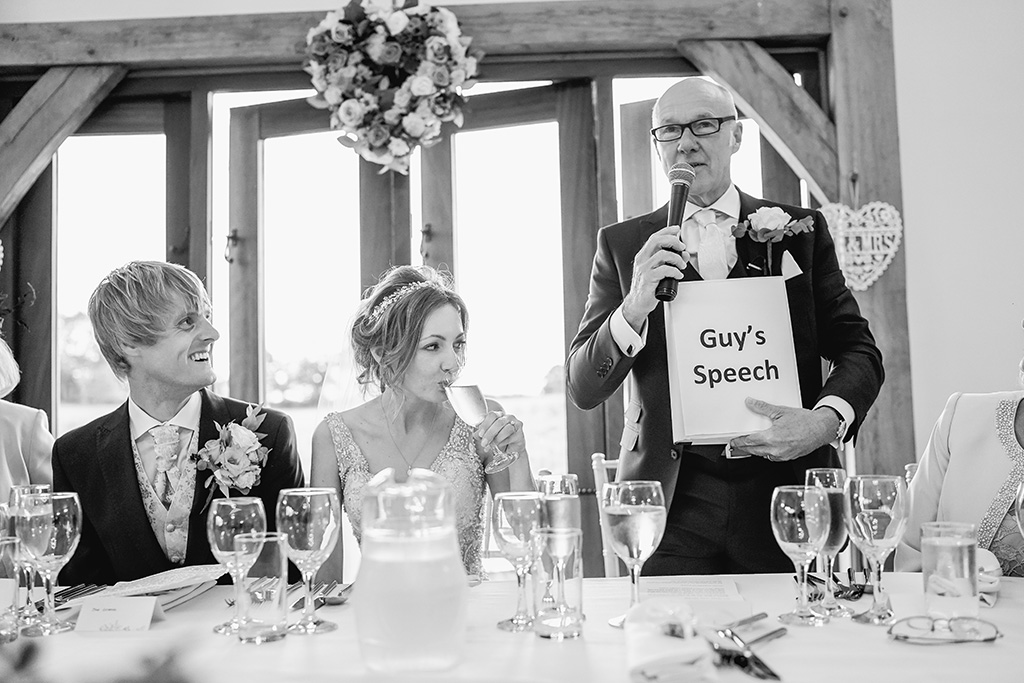 The father of the bride prepares the guests for his speech at Sandhole Oak Barn Cheshire 